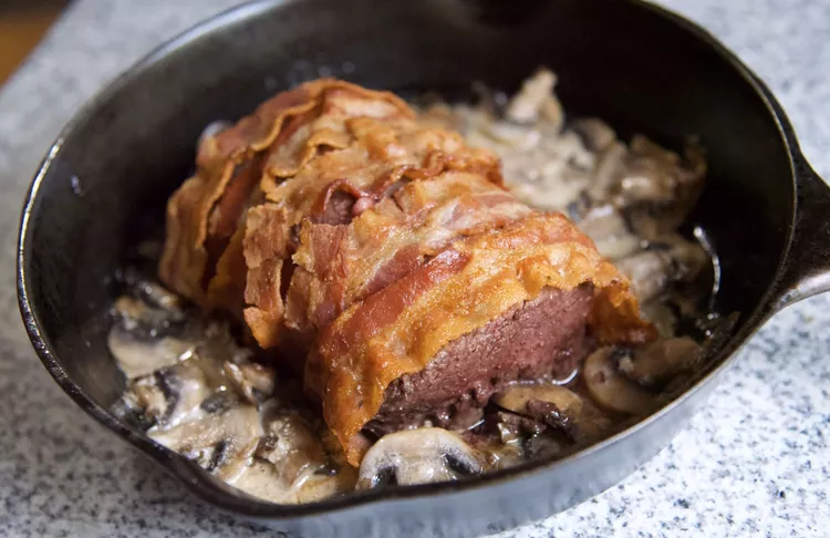 Bacon-Wrapped Venison Tenderloin with Garlic Cream Sauce